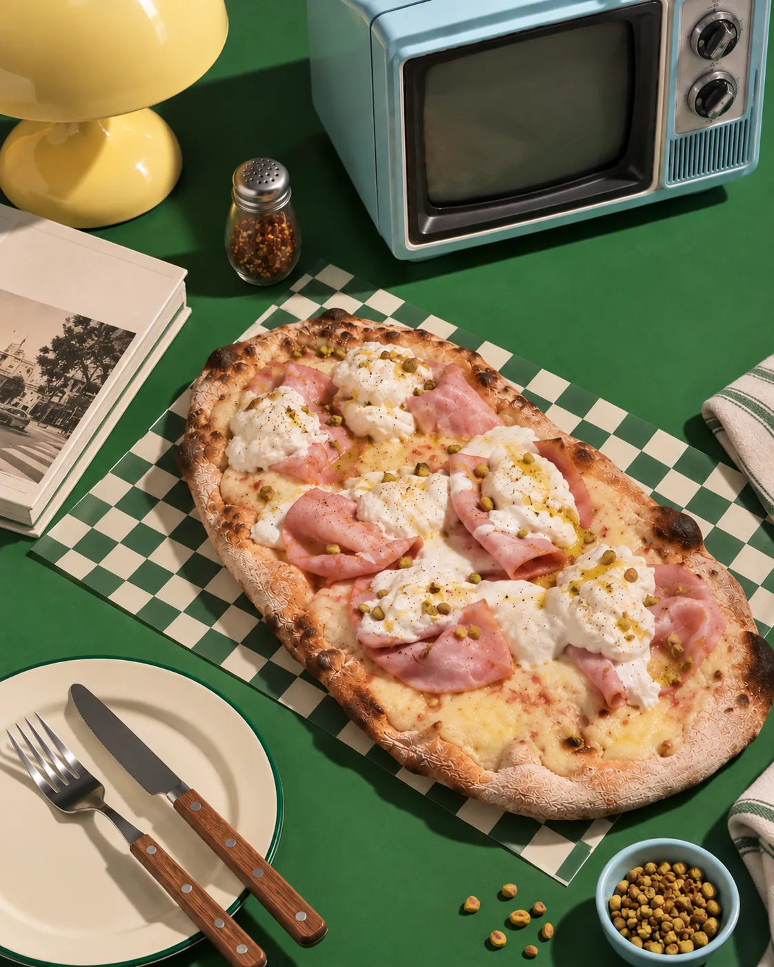 Mortadellosa pinza on a green table with a retro television